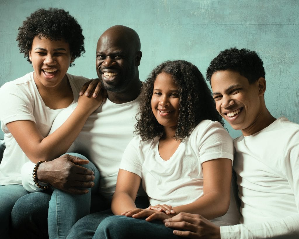 Actor Garfield Wilson and his three smiling kids